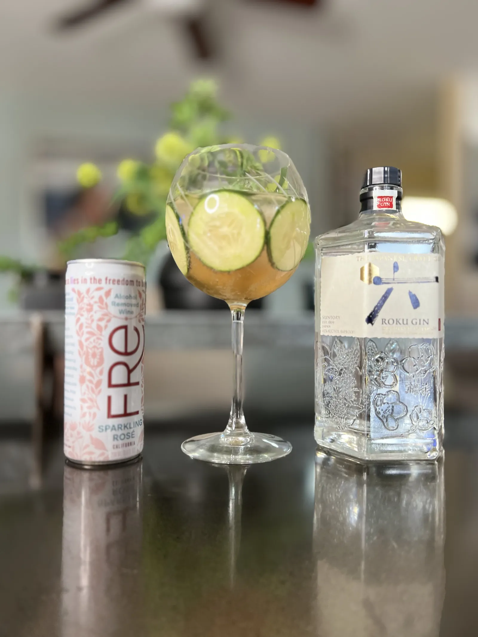 Gin cocktail with cucumber at a styled bar